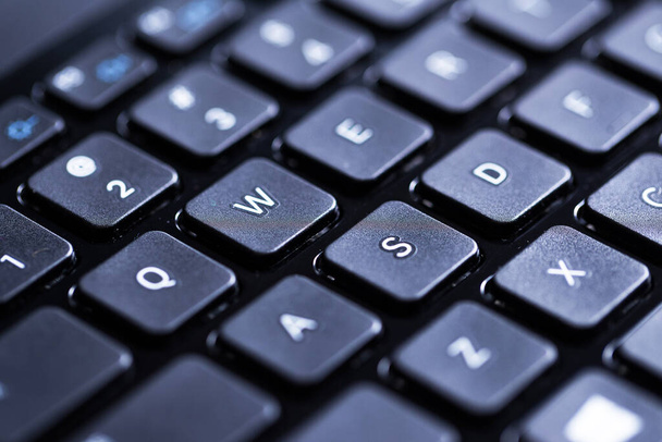 Closeup picture of a glossy laptop keyboard - Zdjęcie, obraz