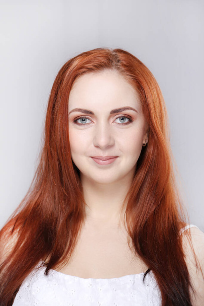 Beautiful woman with red hair - Fotó, kép
