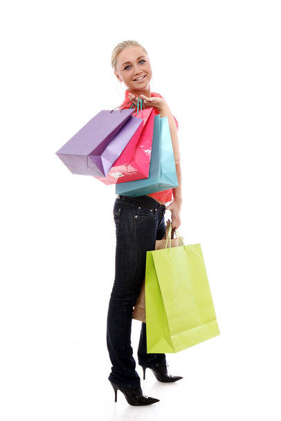 Szczęśliwa kobieta z kolorowe torby na zakupy na białym tle - Zdjęcie, obraz