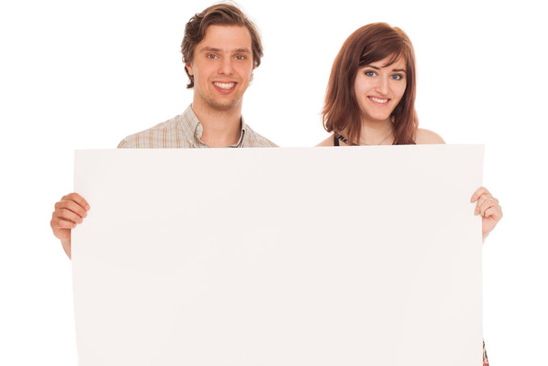 Caucasian couple with blank papers in their hands over white background - Photo, Image