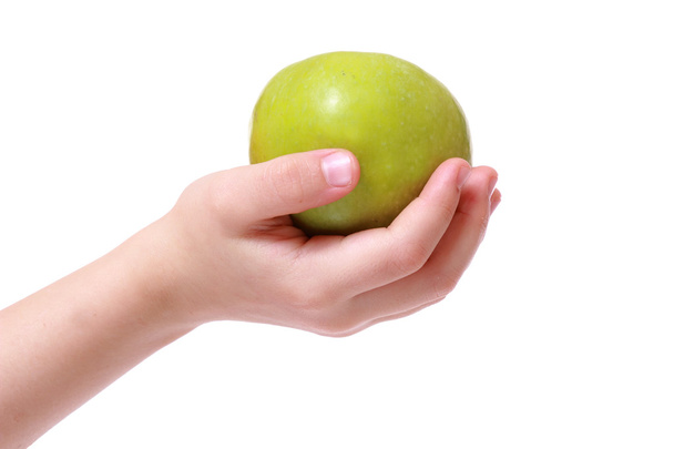Hand with green apple - Фото, изображение
