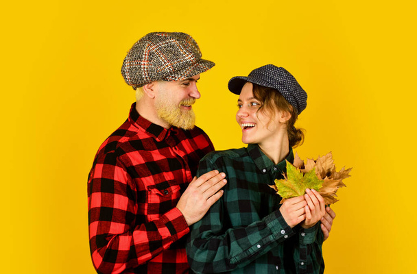 Family time. Couple wear checkered hats and shirts. Fall in love. Happy relations. Vintage style. Cheerful couple dating in september. Autumn mood. Romantic feelings. Couple in love stylish outfit - Zdjęcie, obraz