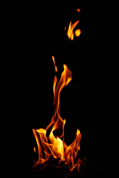 Glowing fire flame over black background - Φωτογραφία, εικόνα