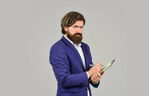 Bearded man making notes. Supervising and controlling. Project Curator. Business people concept. Businessman with folder. Confident businessman holding folder for documents. Control and inspection - Fotografie, Obrázek