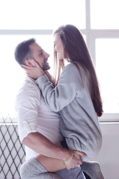 Passion. Cute couple at home - Foto, afbeelding