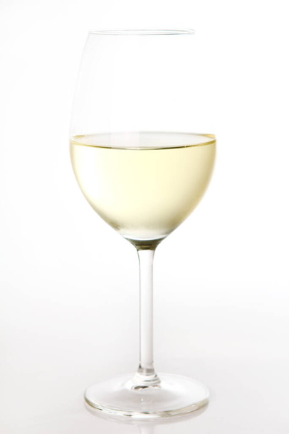 A glass of white wine isolated over background - Foto, imagen