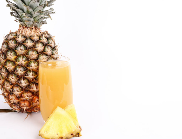 Refreshing pineapple juice on the table - Fotó, kép