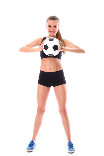 Молода і сексуальна дівчина з футбольним м'ячем на білому тлі
 - Фото, зображення