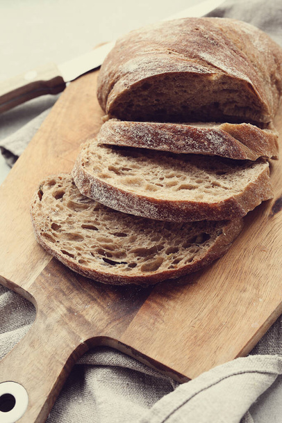 Delicious bread loaf on the table - Фото, зображення