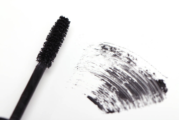 Brush of black mascara for eyes against white background - Photo, Image