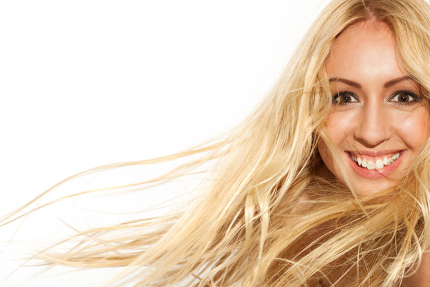 Beautiful blond woman with fluttering hair  - Zdjęcie, obraz