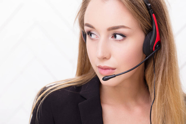 Business people. Woman with blonde hair and headset - Photo, Image
