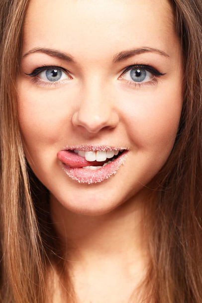 Potrait of cute woman with sugar on lips - Photo, Image