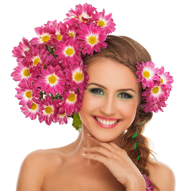 Beautiful young caucasian woman with flowers in hair isolated over white background - Photo, Image