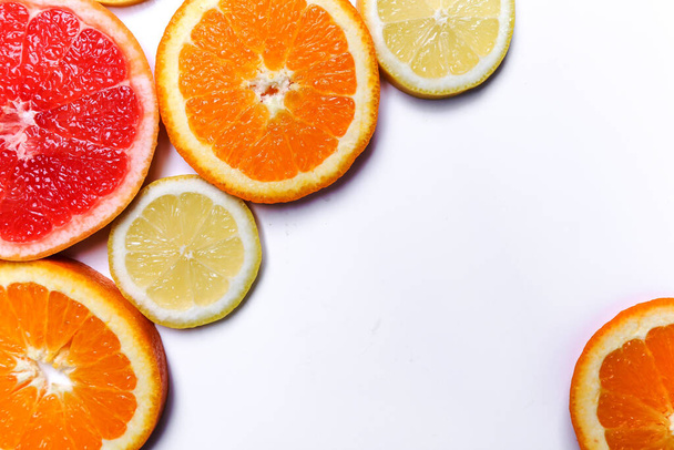 Citrus. Lemon, grapefruit and orange on a white background - Photo, Image
