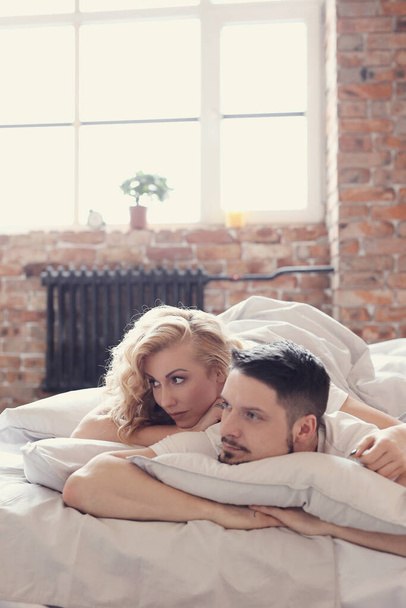 Lifestyle. Beautiful couple in bed - Photo, Image