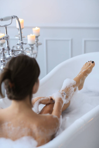 Hygiene. Beautiful girl in a bathtub - Φωτογραφία, εικόνα