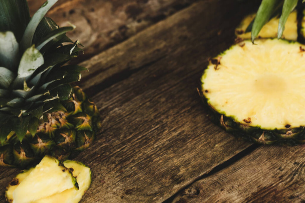Pineapple on a wooden table - Foto, imagen