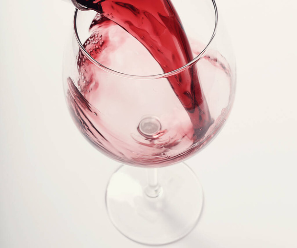 Alcoholic drink. Red wine pouring - Photo, image