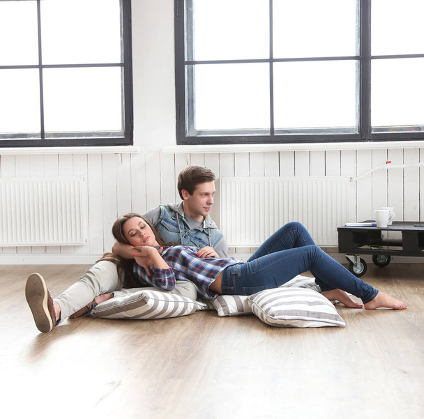 Love, relationship. Beautiful couple on the floor - Foto, Imagen