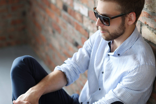 Fashion. Handsome man in sunglasses - Фото, изображение