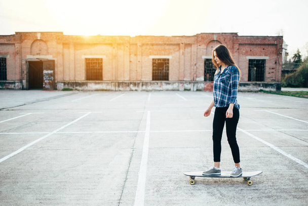 Young teenager girl with skateboard, outdoors - Zdjęcie, obraz