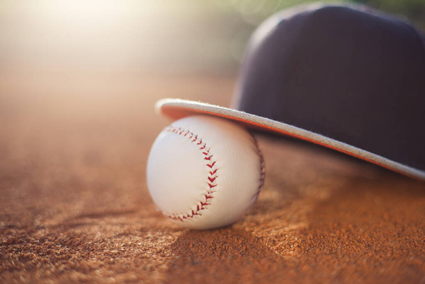 Baseball cap and ball on field - Photo, Image