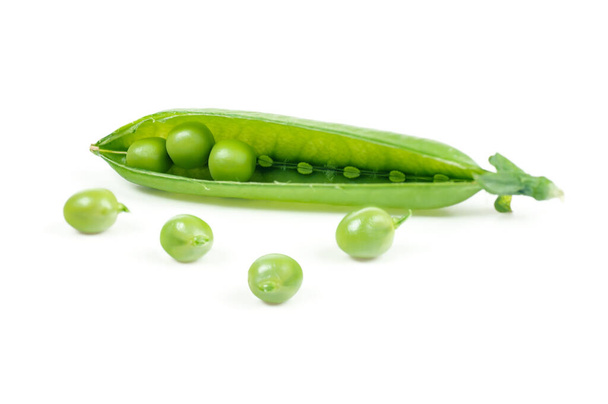 Fresh peas spilled out of the pod. Green pod with peas isolated on white, design element for packagin - Photo, Image