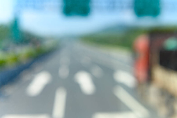 out focus highway lanes with arrows as background - Fotografie, Obrázek
