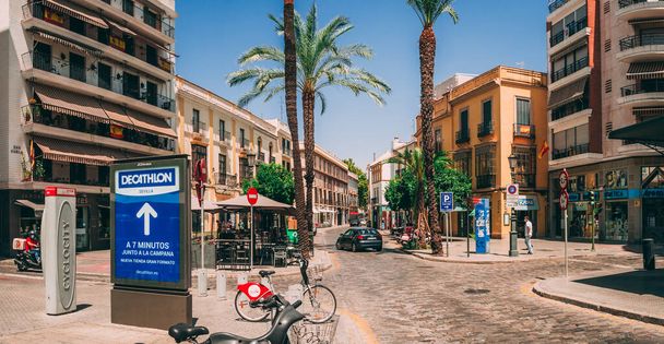 SEVILLE, SPAIN - Jul 30, 2020: Streets of the city center with more than 40 degrees and during covid-19 - Фото, зображення