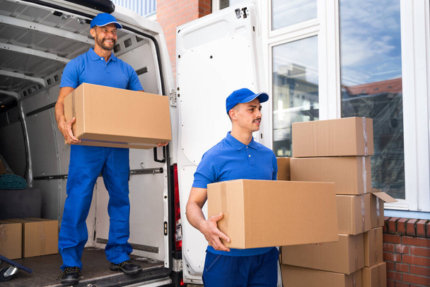 Truck Movers Loading Van Carrying Boxes And Moving House - Photo, image
