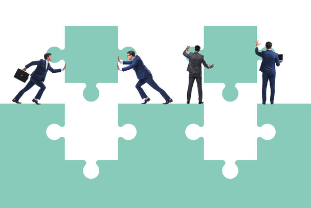 Businessman in teamwork concept with jigsaw puzzle - Photo, Image