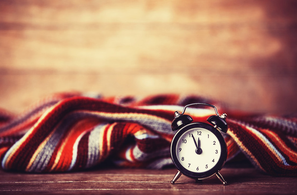Alarm clock and scarf. - Photo, Image