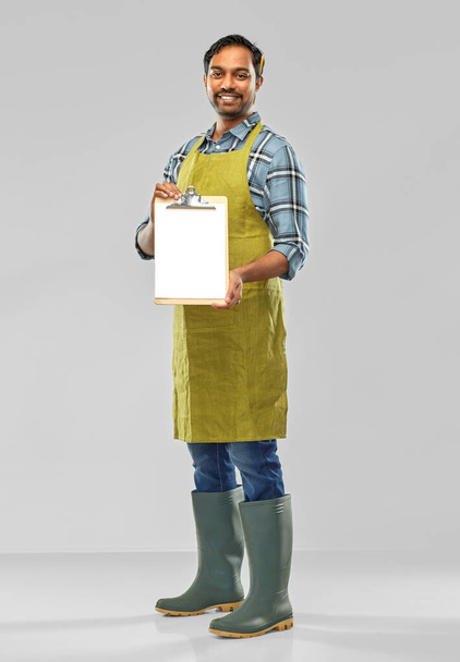 happy indian gardener or farmer with clipboard - Photo, image
