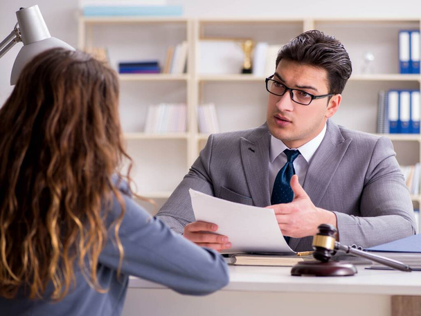 Lawyer discussing legal case with client - Φωτογραφία, εικόνα