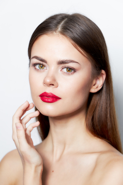 Girl natural look Charm red lips bared shoulders clear skin  - Фото, изображение