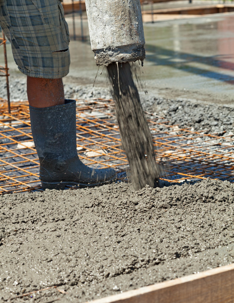 Pouring concrete at a construction site - closeup - Photo, Image
