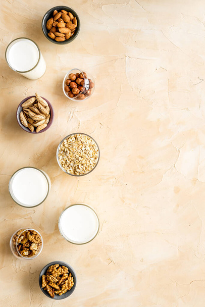 Vegan non-diary milk. Alternative types of milk with nuts and oat - Photo, Image