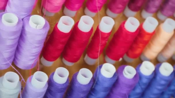 Video of multi colored bobbins of threads - Footage, Video