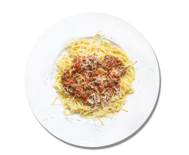 Spaghetti bolognese with parmesan cheese in white plate, isolated - Foto, Imagem
