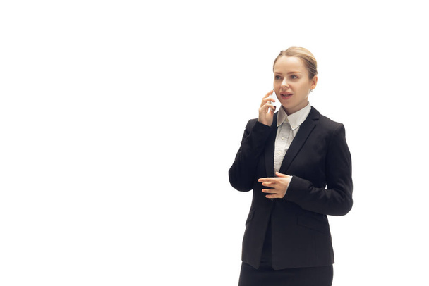 Young woman, accountant, booker in office suit isolated on white studio background - Φωτογραφία, εικόνα