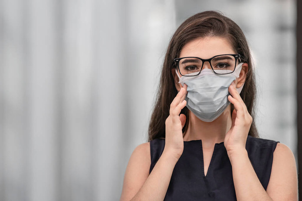 Portrait young woman wearing surgical face mask for preventing and stop corona virus spreading  - Photo, Image