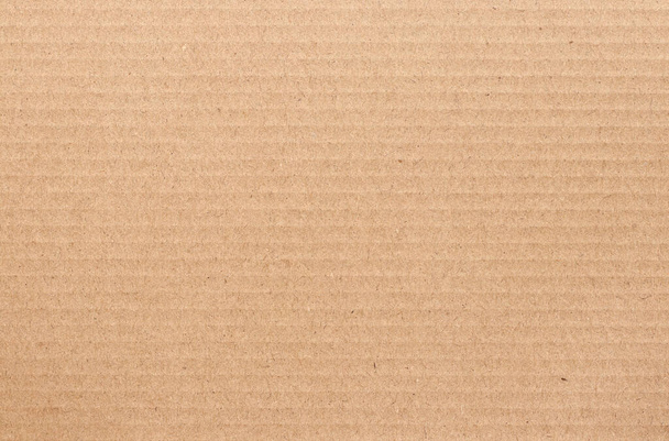 Бурый картонный лист абстрактный фон, текстура рециркуляционной бумажной коробки в старом винтажном рисунке для дизайнерских произведений искусства. - Фото, изображение