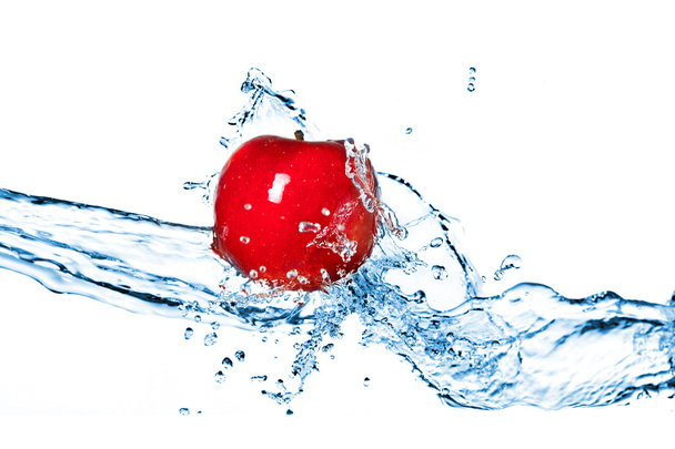 Red apple and water splash isolated on white - Foto, afbeelding