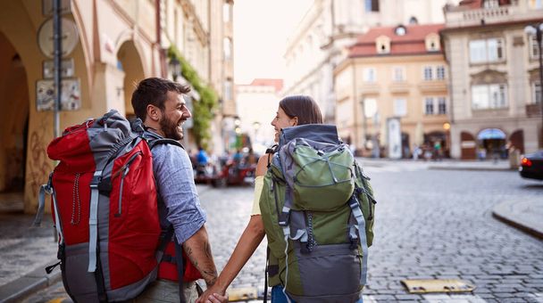 Happy vacation at Europe.Smiling People with backpack in love traveling together.  - Photo, image