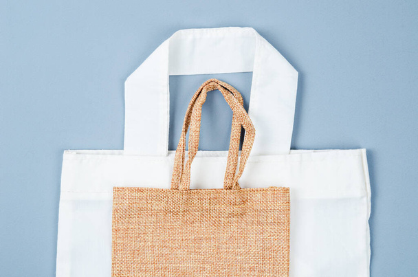Close up canvas fabric bag and sack bag on grey background. - Foto, immagini