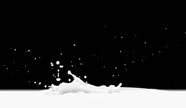 Pouring milk splash isolated on black background - Photo, Image