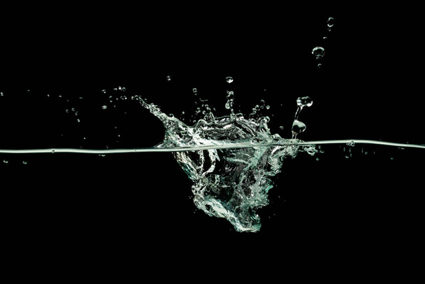 Water drinking, Water wave splash isolated black background. - Foto, Imagem