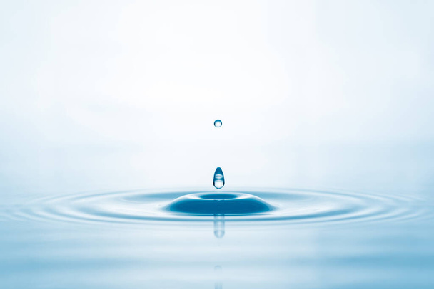 Water droplets on surface water background - Foto, imagen