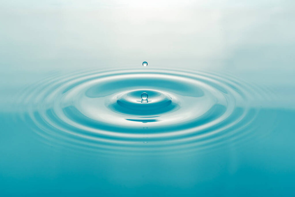 Water droplets on surface water background - Photo, Image